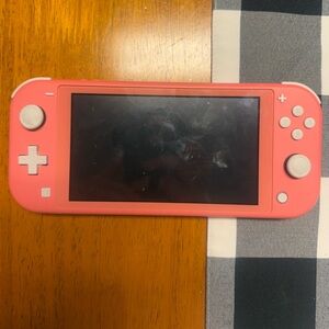 Nintendo Switch Lite Coral with 3 games
